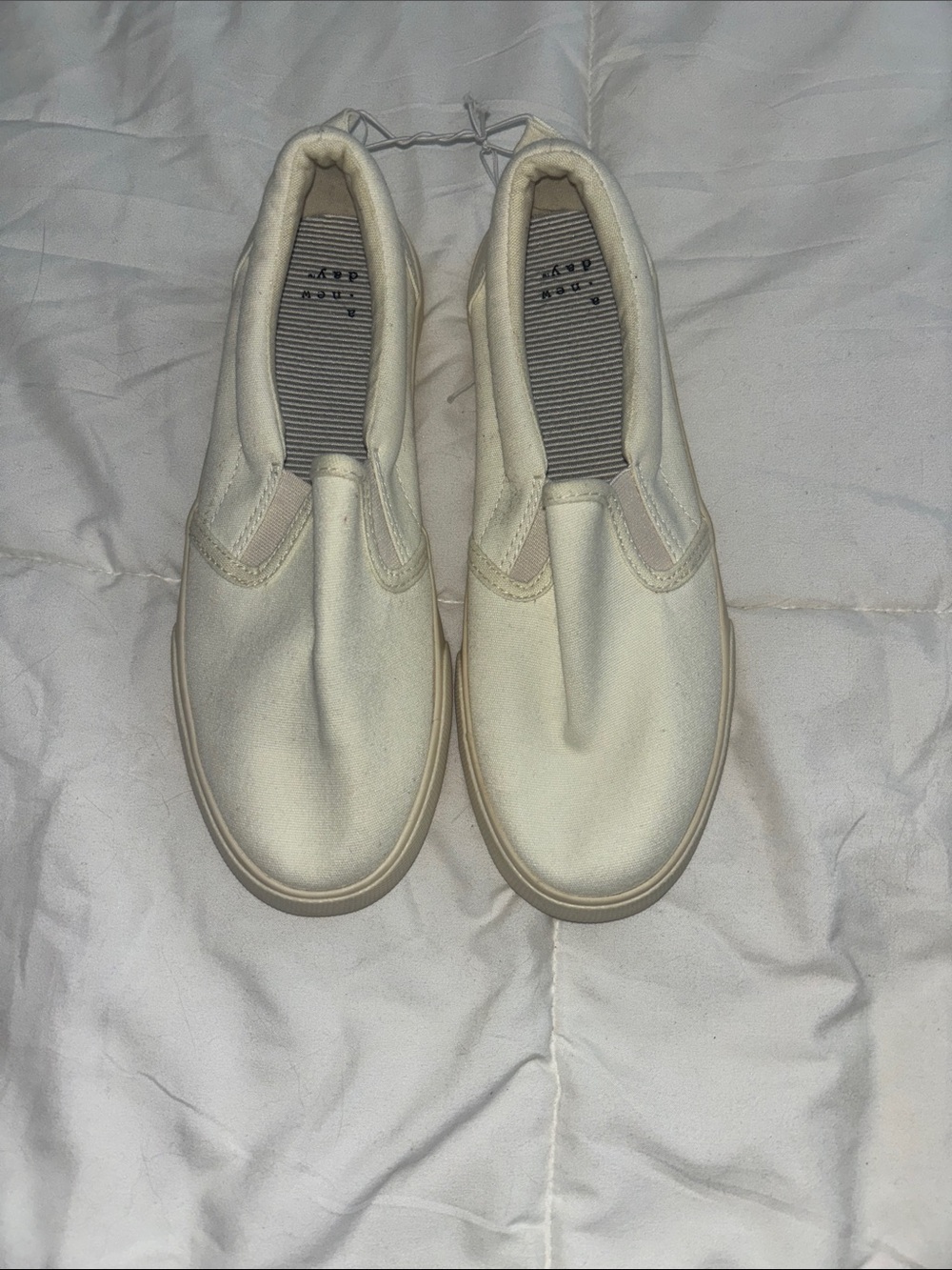 A. New day slip on sneakers